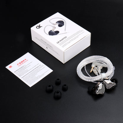 GK Kunten In-ear headphones with packaging, ear tips, and a card on a black background