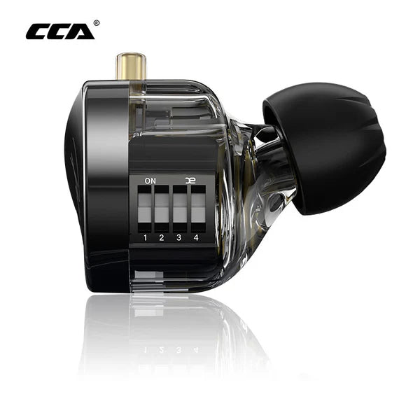 A CCA polaris with a black and transparent body, featuring four sliding switches labeled 1 through 4, a gold-toned connector, and a black textured attachment on the right, shown on a white background with a reflection.