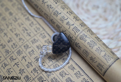 Black Tangzu wan'er SG IEM displayed on an aged, rolled parchment scroll with Chinese calligraphy.