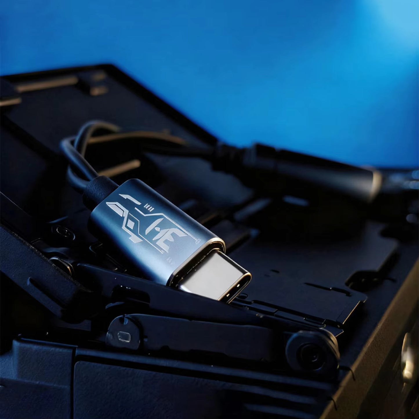 HE Longzhong adapter on top of a case on a dark blue background