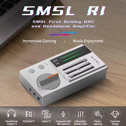 An SMSL RI first-gaming DAC and headphone amplifier shown on a wooden desk with promotional text overlays and feature icons at the bottom.