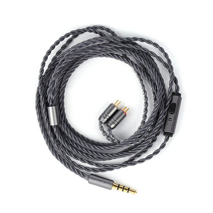 Coiled audio cable with connectors on a white background