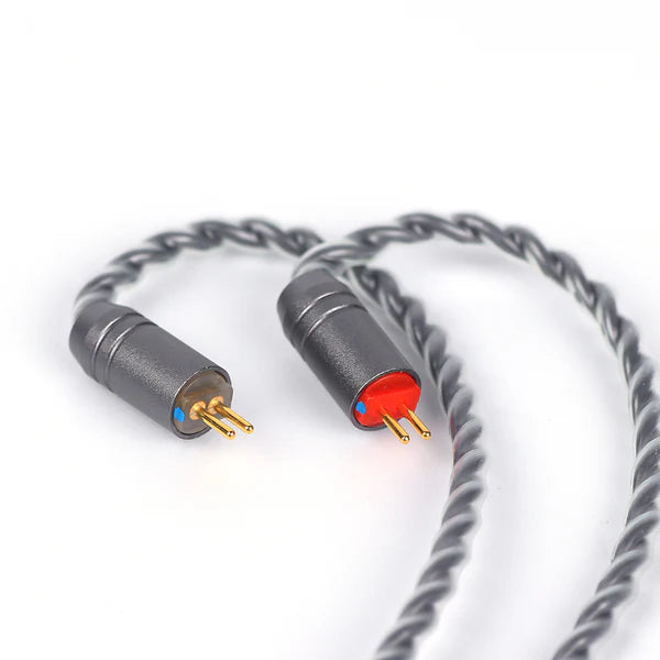 A close-up of a twisted gray audio cable with two connector ends, one showing gold pins with a small blue accent and the other with gold pins and a red accent, on a white background.